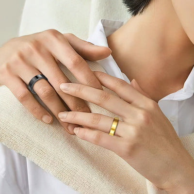 Rivo Ring in Black and Gold worn on two hands